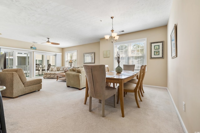 601 N Hillside Dr Unit 3926, North Myrtle Beach, SC 29582 - dining room featuring light carpet, a chandelier, ceiling fan, and a textured ceiling