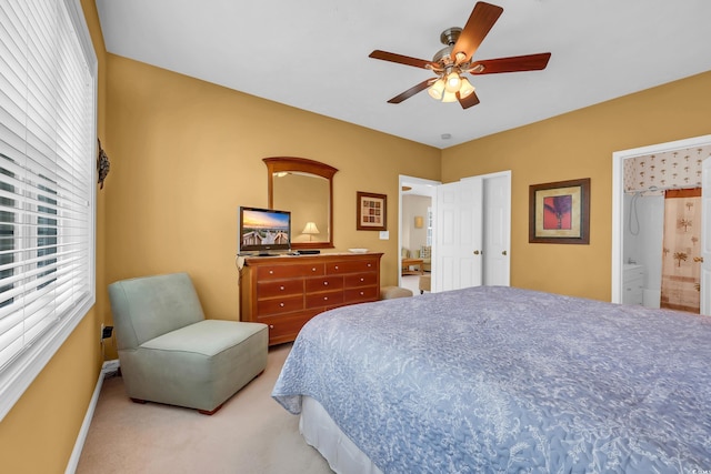601 N Hillside Dr Unit 3926, North Myrtle Beach, SC 29582 - bedroom featuring light carpet, ceiling fan, and ensuite bath