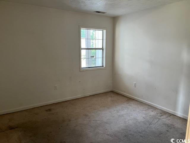 505 White River Dr Unit 25C, Myrtle Beach, SC 29579 - unfurnished room featuring carpet floors and a textured ceiling