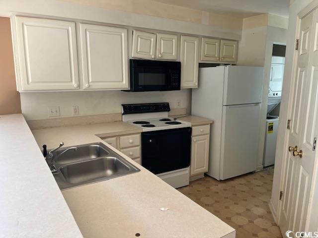505 White River Dr Unit 25C, Myrtle Beach, SC 29579 - kitchen featuring white appliances, light flooring, light countertops, and white cabinetry