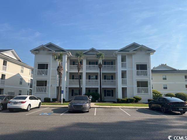 505 White River Dr Unit 25C, Myrtle Beach, SC 29579 - view of building exterior with uncovered parking