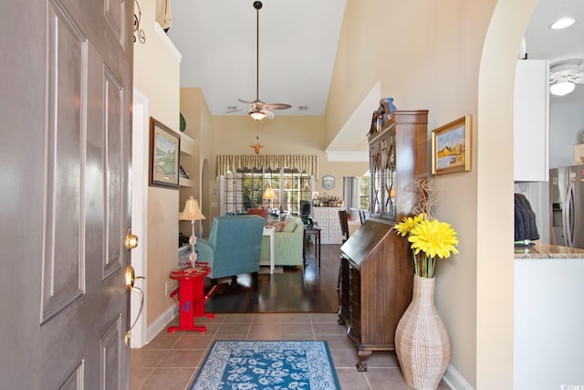 5712 Whistling Duck Dr, North Myrtle Beach, SC 29582 - tiled entrance foyer featuring a ceiling fan, a high ceiling, and arched walkways