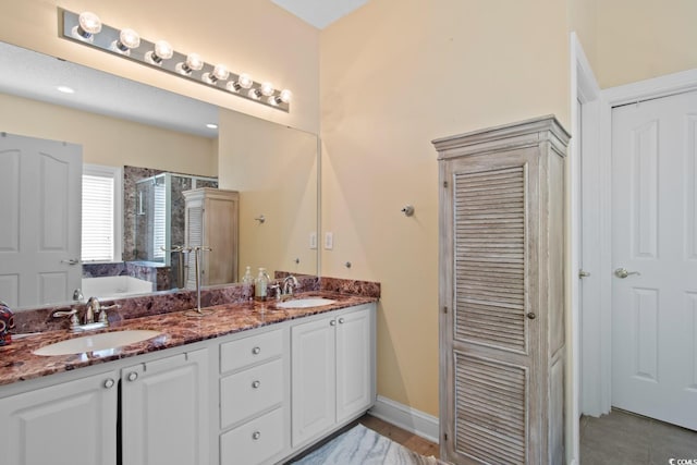 5712 Whistling Duck Dr, North Myrtle Beach, SC 29582 - bathroom featuring double vanity, a bath, a stall shower, and a closet
