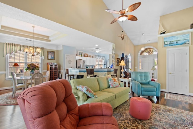 5712 Whistling Duck Dr, North Myrtle Beach, SC 29582 - living room featuring a chandelier, wood finished floors, a ceiling fan, and high vaulted ceiling