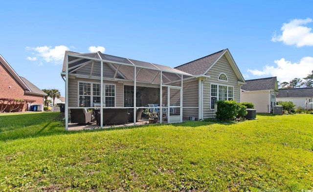 5712 Whistling Duck Dr, North Myrtle Beach, SC 29582 - back of house featuring a yard, a lanai, and roof with shingles