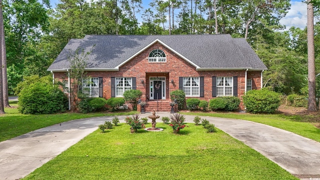 4691 Mill Pond Ct, Murrells Inlet, SC 29576 - view of front of home featuring brick siding, a front lawn, roof with shingles, and driveway