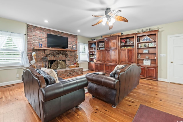 4691 Mill Pond Ct, Murrells Inlet, SC 29576 - living area featuring light wood finished floors, ceiling fan, a brick fireplace, and recessed lighting