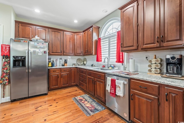 4691 Mill Pond Ct, Murrells Inlet, SC 29576 - kitchen with appliances with stainless steel finishes, light wood-style flooring, decorative backsplash, light stone countertops, and recessed lighting