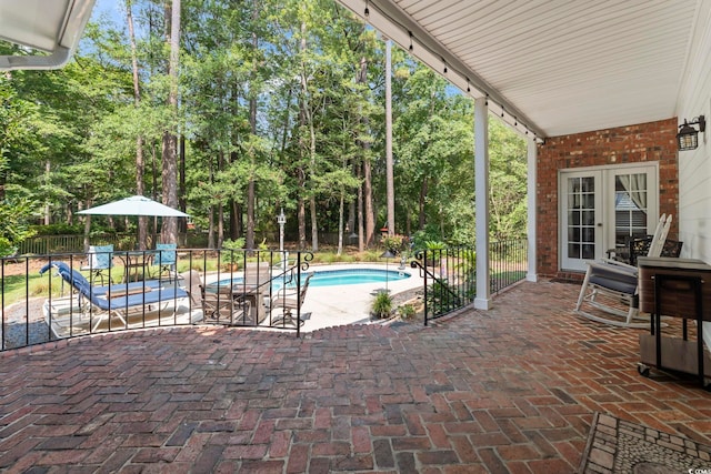 4691 Mill Pond Ct, Murrells Inlet, SC 29576 - view of pool featuring a patio, view of wooded area, and french doors