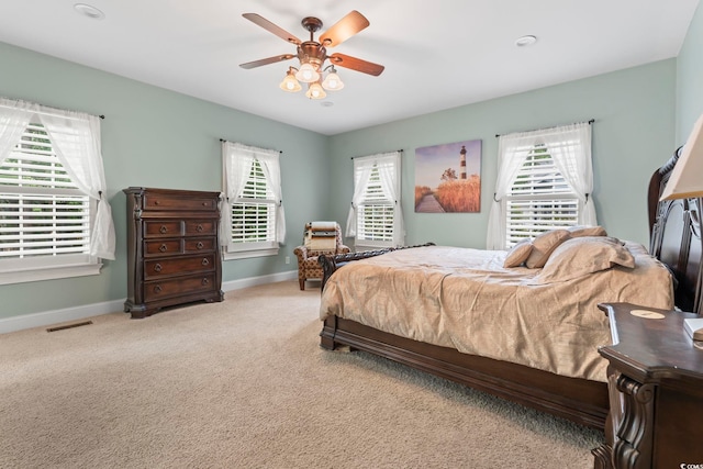 4691 Mill Pond Ct, Murrells Inlet, SC 29576 - bedroom with carpet, multiple windows, and ceiling fan