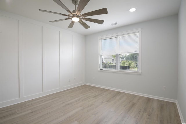 964 Irving Dr, Little River, SC 29566 - spare room with a ceiling fan, light wood finished floors, a decorative wall, and recessed lighting