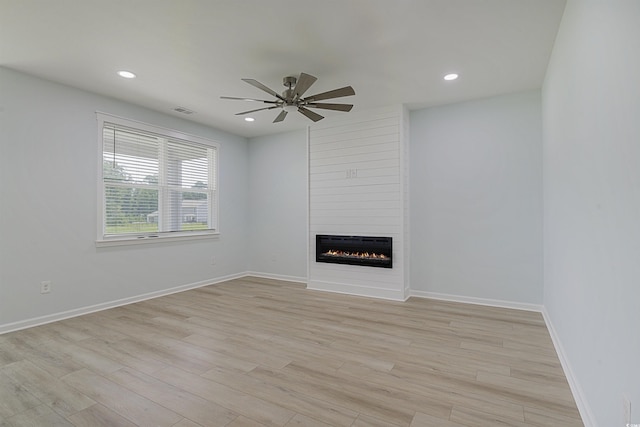 964 Irving Dr, Little River, SC 29566 - unfurnished living room with a fireplace, ceiling fan, light wood-style flooring, and recessed lighting