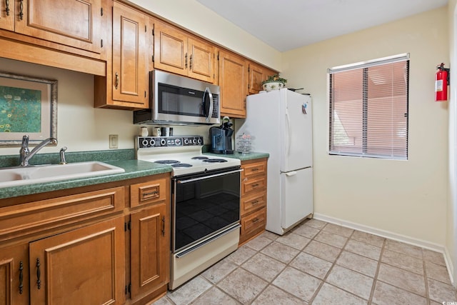 5515 N Ocean Blvd Unit 308, Myrtle Beach, SC 29577 - kitchen with white appliances and brown cabinets