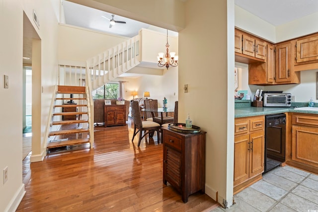 5515 N Ocean Blvd Unit 308, Myrtle Beach, SC 29577 - kitchen with black dishwasher, light wood-style floors, brown cabinetry, and a chandelier