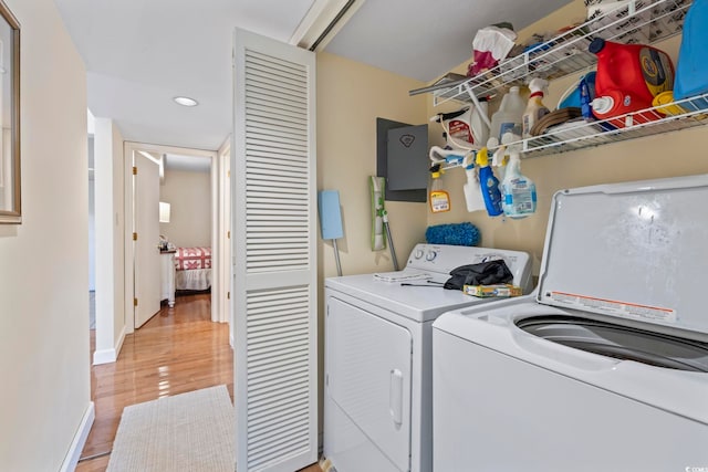 5515 N Ocean Blvd Unit 308, Myrtle Beach, SC 29577 - washroom with washer and clothes dryer, recessed lighting, and light wood-type flooring