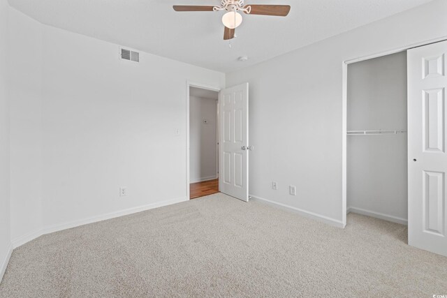 2257 Andover Dr Unit A, Surfside Beach, SC 29575 - unfurnished bedroom with carpet, a closet, and a ceiling fan