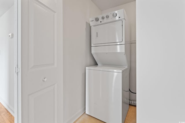 2257 Andover Dr Unit A, Surfside Beach, SC 29575 - laundry area with stacked washer and clothes dryer and baseboards