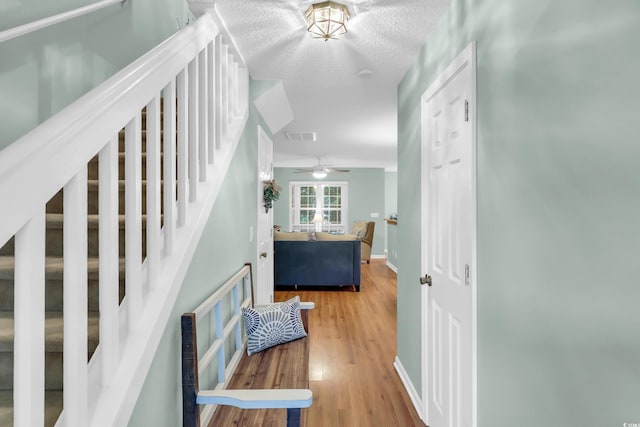 158 Palisade Loop Unit 158, Pawleys Island, SC 29585 - staircase featuring wood finished floors, ceiling fan, and a textured ceiling