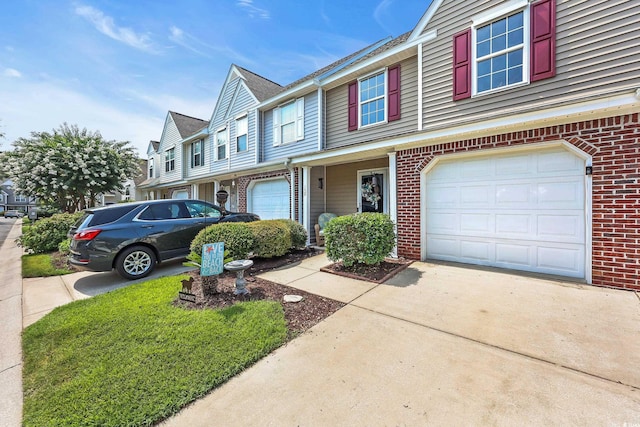 158 Palisade Loop Unit 158, Pawleys Island, SC 29585 - townhome / multi-family property featuring brick siding, concrete driveway, and a garage