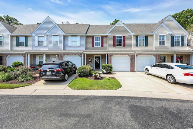 158 Palisade Loop Unit 158, Pawleys Island, SC 29585 - view of property with driveway, a garage, brick siding, and a shingled roof