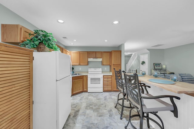 158 Palisade Loop Unit 158, Pawleys Island, SC 29585 - kitchen with white appliances, under cabinet range hood, light countertops, and recessed lighting