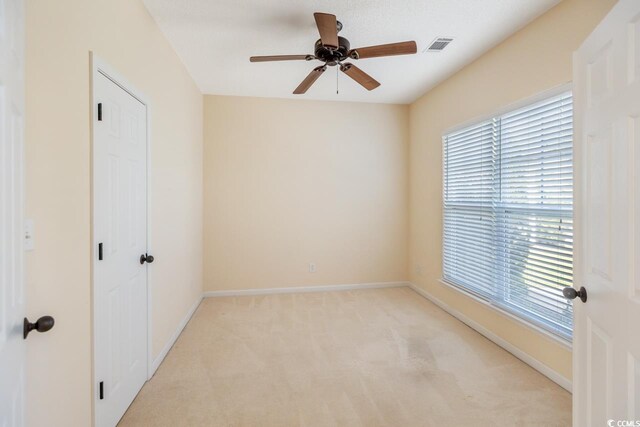 56 Willowbend Dr, Murrells Inlet, SC 29576 - unfurnished bedroom with light carpet and ceiling fan