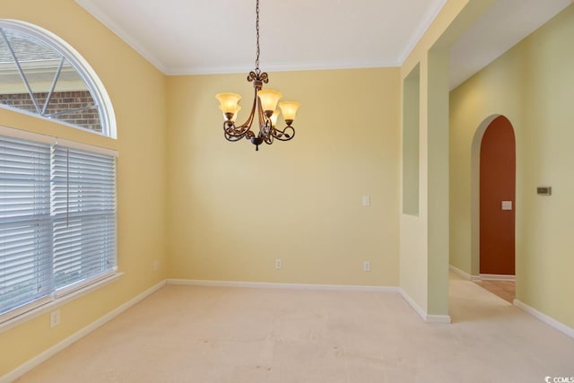 56 Willowbend Dr, Murrells Inlet, SC 29576 - empty room with a chandelier, arched walkways, light carpet, healthy amount of natural light, and ornamental molding