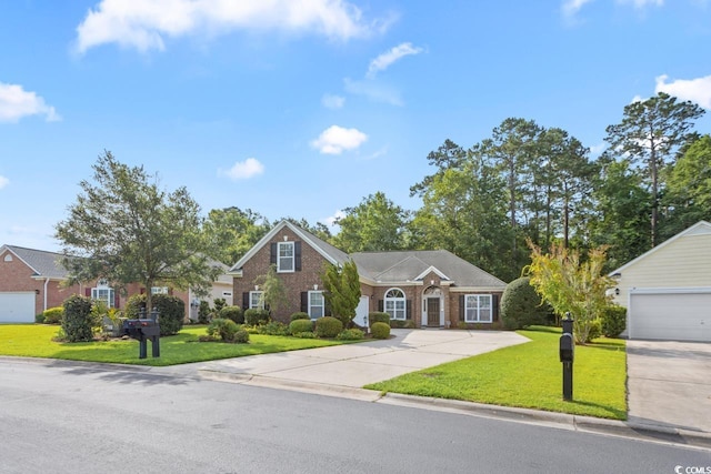 56 Willowbend Dr, Murrells Inlet, SC 29576 - view of front of house with a front yard, brick siding, and concrete driveway