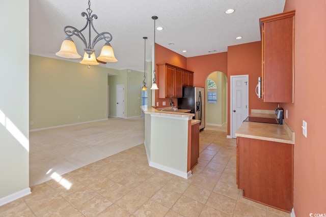 56 Willowbend Dr, Murrells Inlet, SC 29576 - kitchen featuring arched walkways, stainless steel fridge, light countertops, range, and recessed lighting