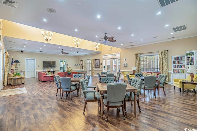 56 Willowbend Dr, Murrells Inlet, SC 29576 - dining area featuring ceiling fan, wood finished floors, recessed lighting, crown molding, and a chandelier