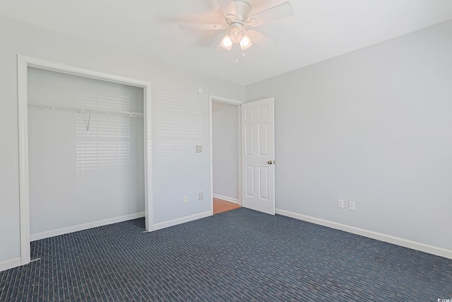 3888 Stillwood Dr, Myrtle Beach, SC 29588 - unfurnished bedroom with dark carpet, a closet, and a ceiling fan