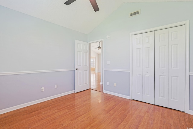 3888 Stillwood Dr, Myrtle Beach, SC 29588 - unfurnished bedroom with light wood-style flooring, a closet, ceiling fan, and high vaulted ceiling