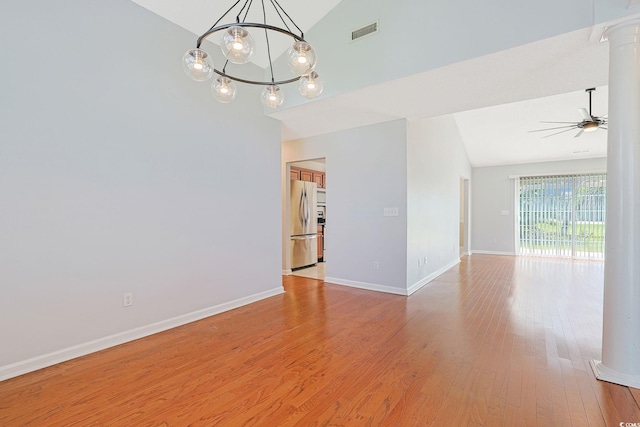 3888 Stillwood Dr, Myrtle Beach, SC 29588 - unfurnished room featuring a chandelier, high vaulted ceiling, light wood-type flooring, a ceiling fan, and decorative columns