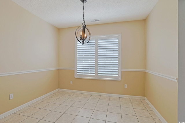 3888 Stillwood Dr, Myrtle Beach, SC 29588 - tiled spare room with a textured ceiling and a chandelier