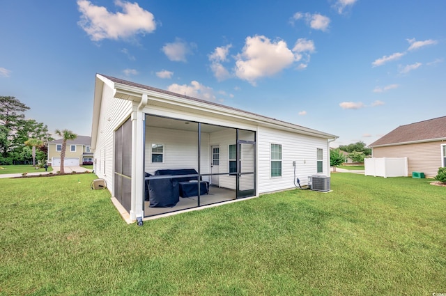 2143 Stonecrest Dr NW, Calabash, NC 28467 - rear view of property with a lawn and a sunroom