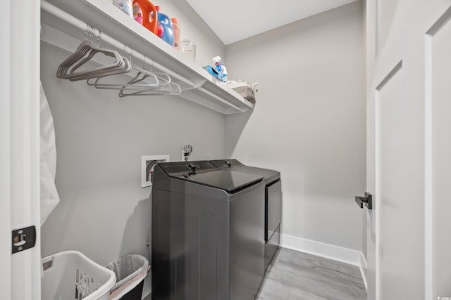 2143 Stonecrest Dr NW, Calabash, NC 28467 - laundry room featuring washing machine and dryer and wood finished floors