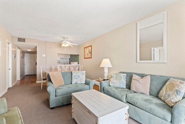 601 Mitchell Dr # 607, Myrtle Beach, SC 29577 - carpeted living area featuring a ceiling fan and baseboards