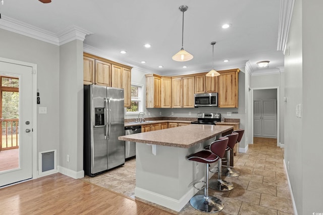 2135 Starduster Ln, Little River, SC 29566 - kitchen featuring stainless steel appliances, crown molding, a kitchen bar, recessed lighting, and a kitchen island