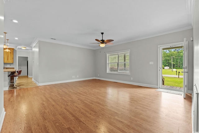 2135 Starduster Ln, Little River, SC 29566 - unfurnished living room featuring ceiling fan, healthy amount of natural light, crown molding, light wood-style flooring, and recessed lighting