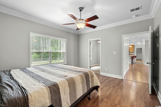 2135 Starduster Ln, Little River, SC 29566 - bedroom featuring crown molding, wood finished floors, and a ceiling fan