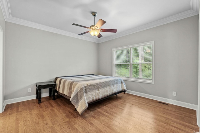 2135 Starduster Ln, Little River, SC 29566 - bedroom with wood finished floors, ornamental molding, and ceiling fan