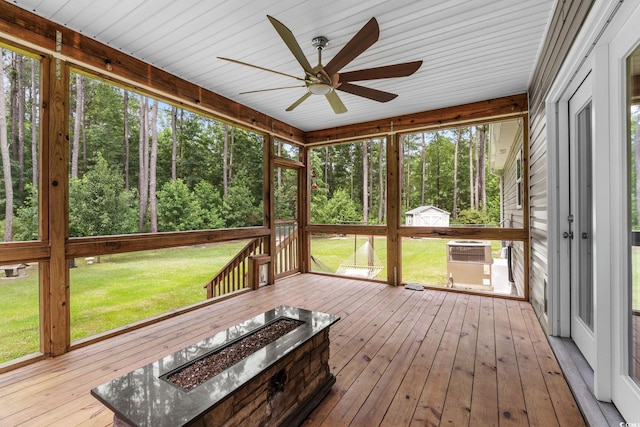 2135 Starduster Ln, Little River, SC 29566 - unfurnished sunroom with a ceiling fan and a fire pit
