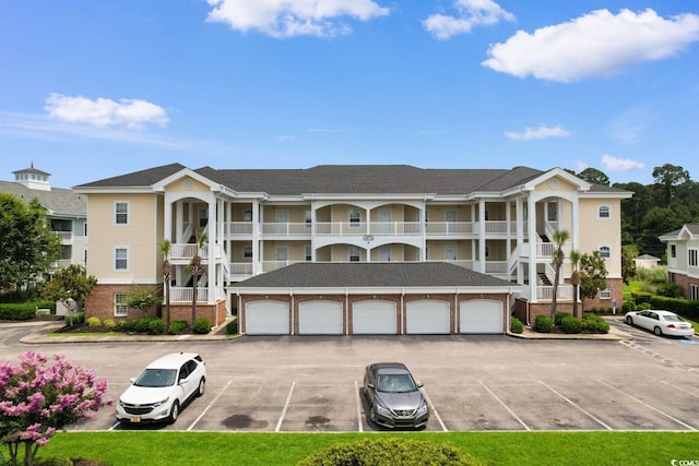 4872 Dahlia Ct Unit 305, Myrtle Beach, SC 29577 - view of property featuring community garages and uncovered parking