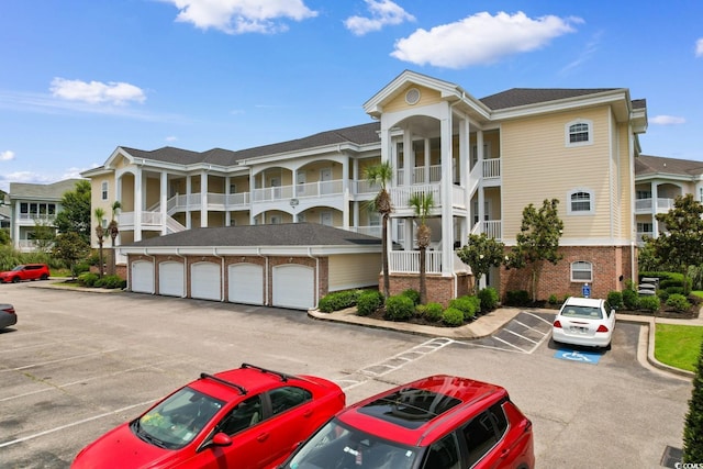 4872 Dahlia Ct Unit 305, Myrtle Beach, SC 29577 - view of property with uncovered parking and community garages