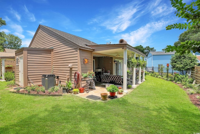 709 Jerdon Cir N, Myrtle Beach, SC 29582 - back of property featuring a patio, a ceiling fan, and a shingled roof