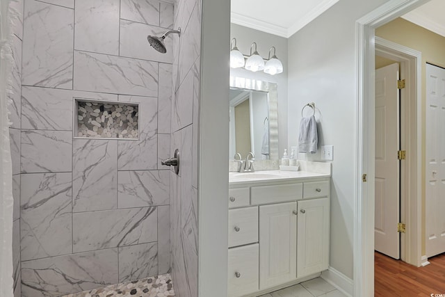 709 Jerdon Cir N, Myrtle Beach, SC 29582 - bathroom with tiled shower, vanity, ornamental molding, and wood finished floors