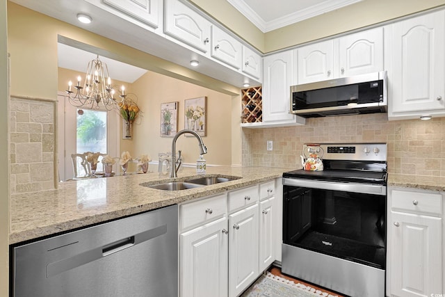 709 Jerdon Cir N, Myrtle Beach, SC 29582 - kitchen featuring appliances with stainless steel finishes, crown molding, white cabinetry, a peninsula, and a chandelier