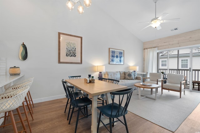 901 W Port Dr Unit 2114, North Myrtle Beach, SC 29582 - dining room featuring high vaulted ceiling, wood finished floors, a chandelier, and a ceiling fan