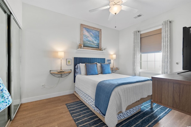 901 W Port Dr Unit 2114, North Myrtle Beach, SC 29582 - bedroom with wood finished floors, ceiling fan, and a closet