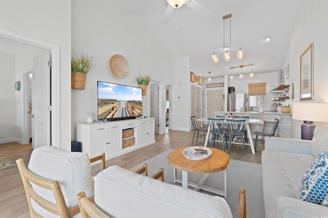 901 W Port Dr Unit 2114, North Myrtle Beach, SC 29582 - living area with light wood-style floors, a ceiling fan, and high vaulted ceiling